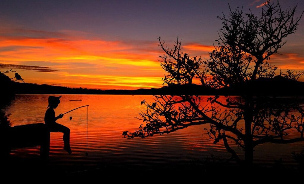 A Boy is Sitting for Fishing as a Beginner