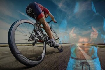an athlete in a clean road in a cycle to understand is cycling good for abs.