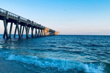 A bridge on the blue water in Navarre Beach Pier