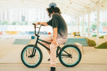 a tall guy on a BMX bike